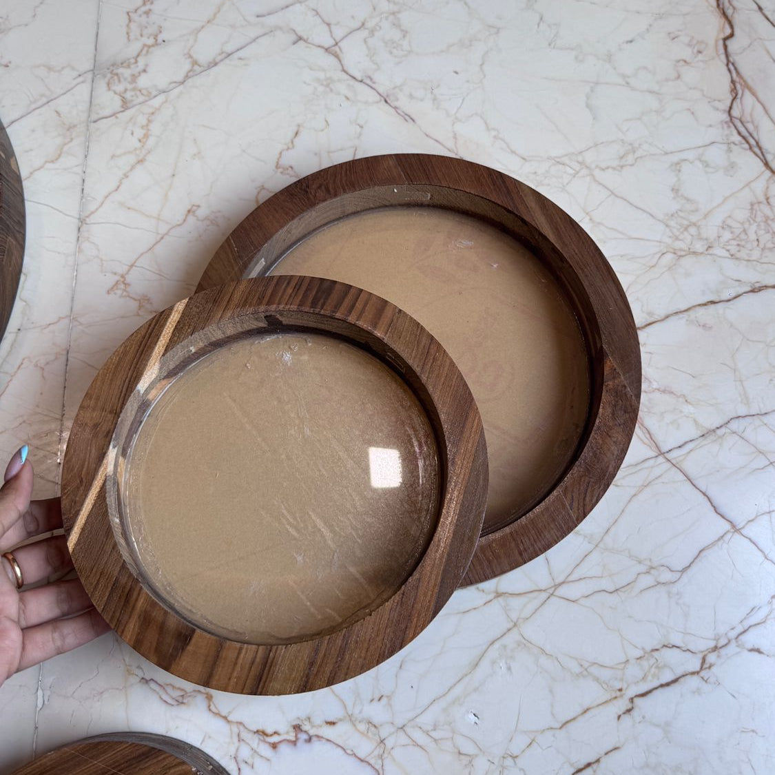 Wooden bowls on a marble surface